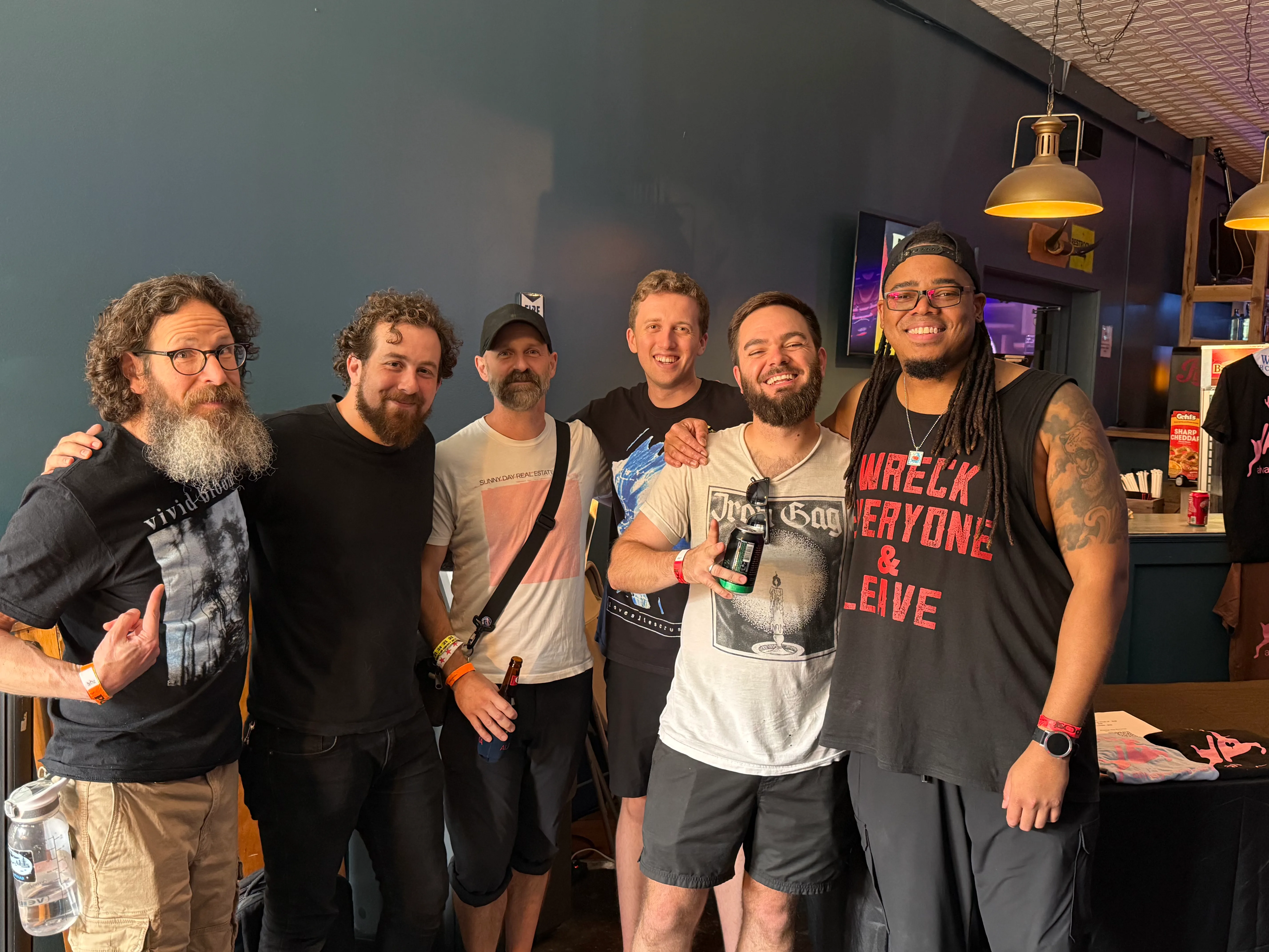 The author Josh Burke (left) and his friend Lee (middle with messenger bag) with the band Lesotho at Post Fest